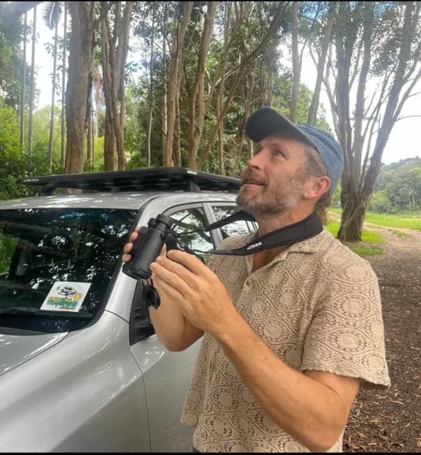 Clayton Smith, birding guide with binoculars
